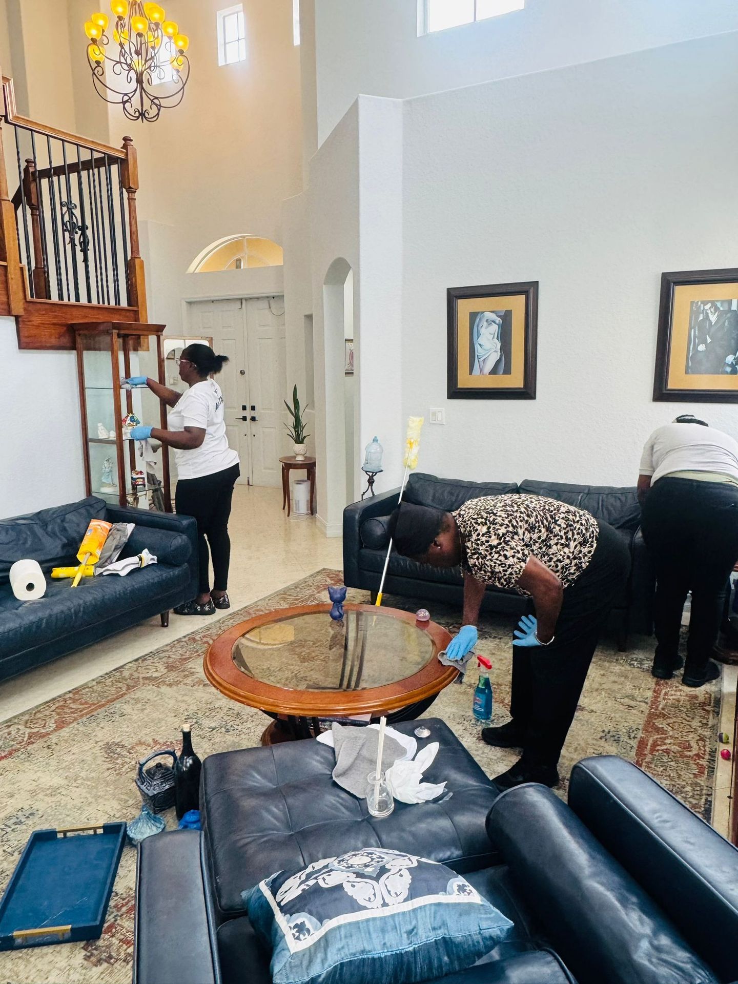 Two woman cleaning a spacious house