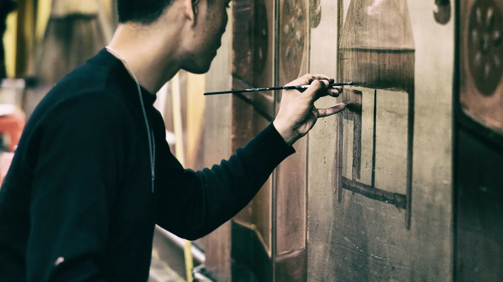 Painter using a brush against canvas